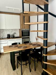 Kuchyňa alebo kuchynka v ubytovaní Apartamenty Lobeliowy Port