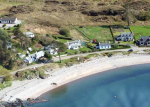 an aerial view of a beach with houses at Tigh na Camus in Glenelg