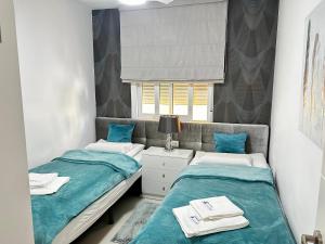 Posteľ alebo postele v izbe v ubytovaní Apartamento Elizabeth