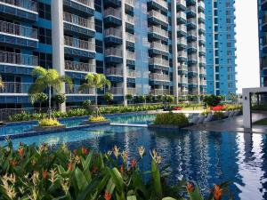 an image of an apartment complex with a swimming pool at Residential Resort Condo by the Bay in Manila