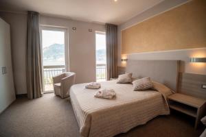 Postel nebo postele na pokoji v ubytování Hotel Garni Rosmari + 37 fotografií