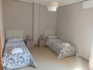 A bed or beds in a room at Villa Iris