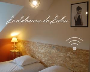 Posteľ alebo postele v izbe v ubytovaní Résidence Leclerc - Appartements d'hôtes - Secteur thermal