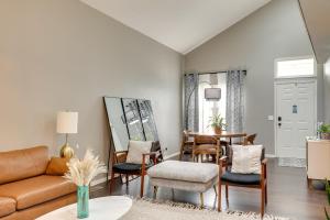 a living room with a couch and a table at Charming Omaha Vacation Rental 1 Mi to Downtown! in Omaha