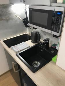 Kuchyňa alebo kuchynka v ubytovaní Deviza Apartments