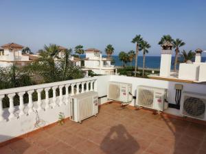 a balcony with two air conditioners on a house at Luxury Paradise Beach Villa in Vera