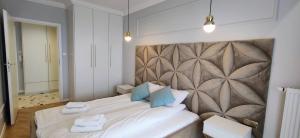 Posteľ alebo postele v izbe v ubytovaní Apartament Westin House 312