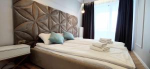 Posteľ alebo postele v izbe v ubytovaní Apartament Westin House 312