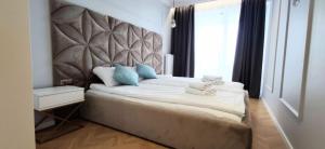 Posteľ alebo postele v izbe v ubytovaní Apartament Westin House 312
