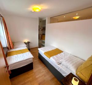 Postel nebo postele na pokoji v ubytování Negrelli Appartement + 29 fotografií