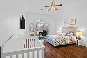 a bedroom with a bed and a ceiling fan at Luxury Family Retreat in Frisco, TX in Frisco