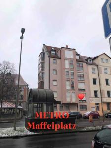 a bus is parked in front of a building at Apartment, Messe 5 min., City 3 min., wifi in Nuremberg