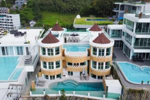 an aerial view of a building with a swimming pool at Castle Patong amazing private pool villa in great Location of Patong in Patong Beach