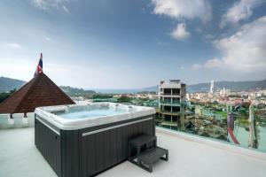 a hot tub on the roof of a building at Castle Patong amazing private pool villa in great Location of Patong in Patong Beach