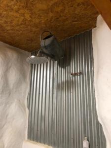 a shoe hanging from the ceiling of a building at Rabbits 1or 2 bedroom hobbit style hillset earthen dartmoor eco home in South Brent