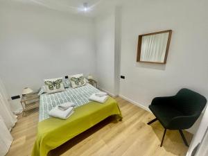 Säng eller sängar i ett rum på NEW CAPUCHINOS Apartment 2
