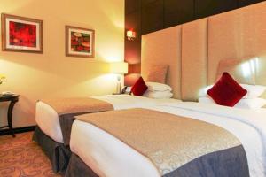 Katil atau katil-katil dalam bilik di Century Hotel Doha