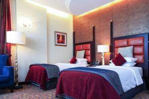 Katil atau katil-katil dalam bilik di Century Hotel Doha