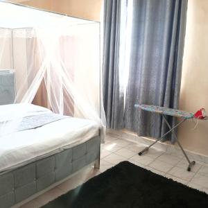 Postel nebo postele na pokoji v ubytování Milly's homes