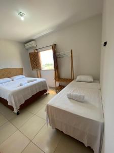 Postel nebo postele na pokoji v ubytování Viva Praia Flats, maravilhosa hospedagem na praia!