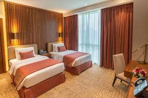Katil atau katil-katil dalam bilik di Century Hotel Doha