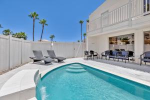 a swimming pool in the backyard of a house at Luxury Beachfront Condo with Private Pool &Terrace in South Padre Island