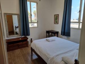 Postel nebo postele na pokoji v ubytování Haifa Hostel
