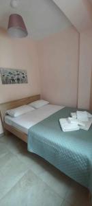Postel nebo postele na pokoji v ubytování Aggeliki's Apartments