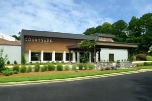 a building on the side of a street at Courtyard by Marriott Raleigh Cary in Cary