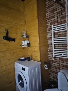 a bathroom with a washing machine in a room at Tbilisi Mood in Tbilisi City