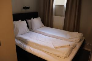 Postel nebo postele na pokoji v ubytování Hotel Hötorget