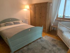 Cama ou camas em um quarto em Villa Maria Baselga di Pinè Appartamenti