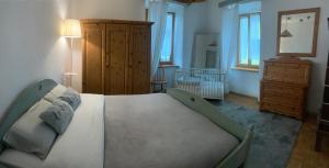 Een bed of bedden in een kamer bij Villa Maria Baselga di Pinè Appartamenti