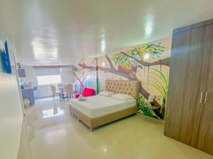 Postel nebo postele na pokoji v ubytování Hotel Hernández CTG