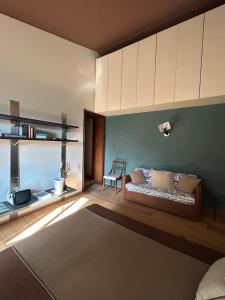a living room with a couch and a table at Bed&Breakfast La Madonnina in Marlia