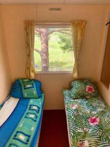 Postelja oz. postelje v sobi nastanitve Holenderki na Zielonych Wzgórzach, Łowyń