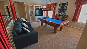 a living room with a pool table in it at BEAUTIFUL VACATION HOME RENTAL WITH TROPICAl STYLE HEATED POOL & HOT TUB in Alvin