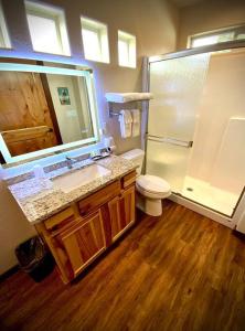 a bathroom with a sink and a shower and a toilet at Bear Mountain - Suite 4 in Grants Pass