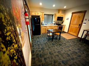 a kitchen with a table in the middle of a room at Bear Mountain - Suite 4 in Grants Pass
