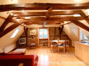 a kitchen and dining room with a table and chairs at Ferienwohnungen Ferienland Cochem in Bruttig-Fankel