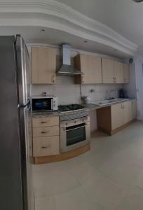 Virtuvė arba virtuvėlė apgyvendinimo įstaigoje Perle du Lac
