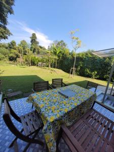 a table and chairs with a table cloth on it at Brook Villa Khaoyai in Pak Chong