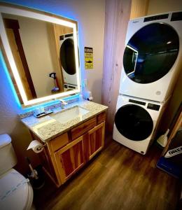a bathroom with a sink and a large mirror at Bear Mountain - Suite 6 in Grants Pass