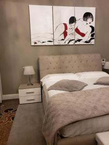 Ένα ή περισσότερα κρεβάτια σε δωμάτιο στο Varazze Suite Sauna e Hammam