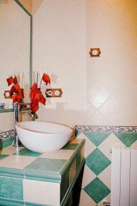 a bathroom with a bowl sink on a counter at Casa Rural Cristina III in San Pablo de los Montes