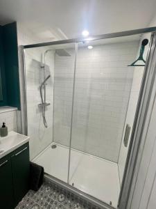 a shower with a glass door in a bathroom at 16 Macgregor court, Oban in Oban