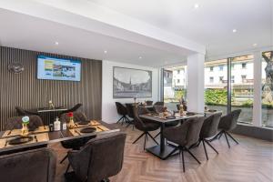 TV a/nebo společenská místnost v ubytování Hotel Das Q Spaichingen