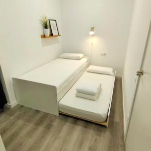 Posteľ alebo postele v izbe v ubytovaní Mediterranean Barcelona Apartments