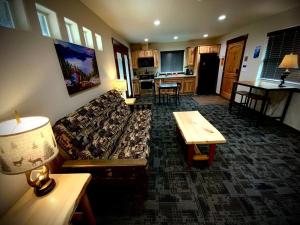 a living room with a couch and a table at Bear Mountain Suite 10 in Grants Pass