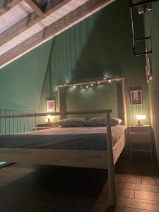 a bedroom with a bed with lights on it at Sala dell Estate Guest House in Secchia